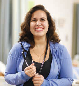 Student with stethoscope, smiling